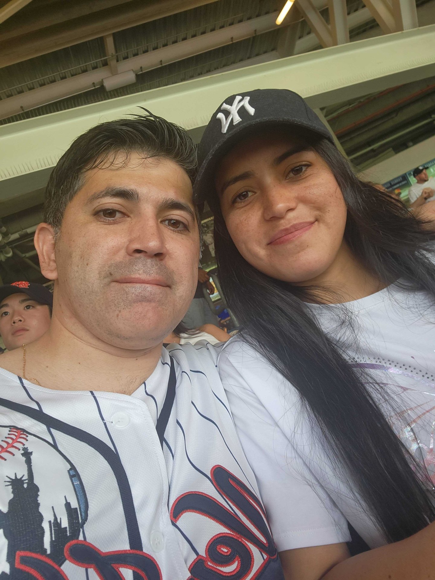 Angélica and Esteban at a baseball game