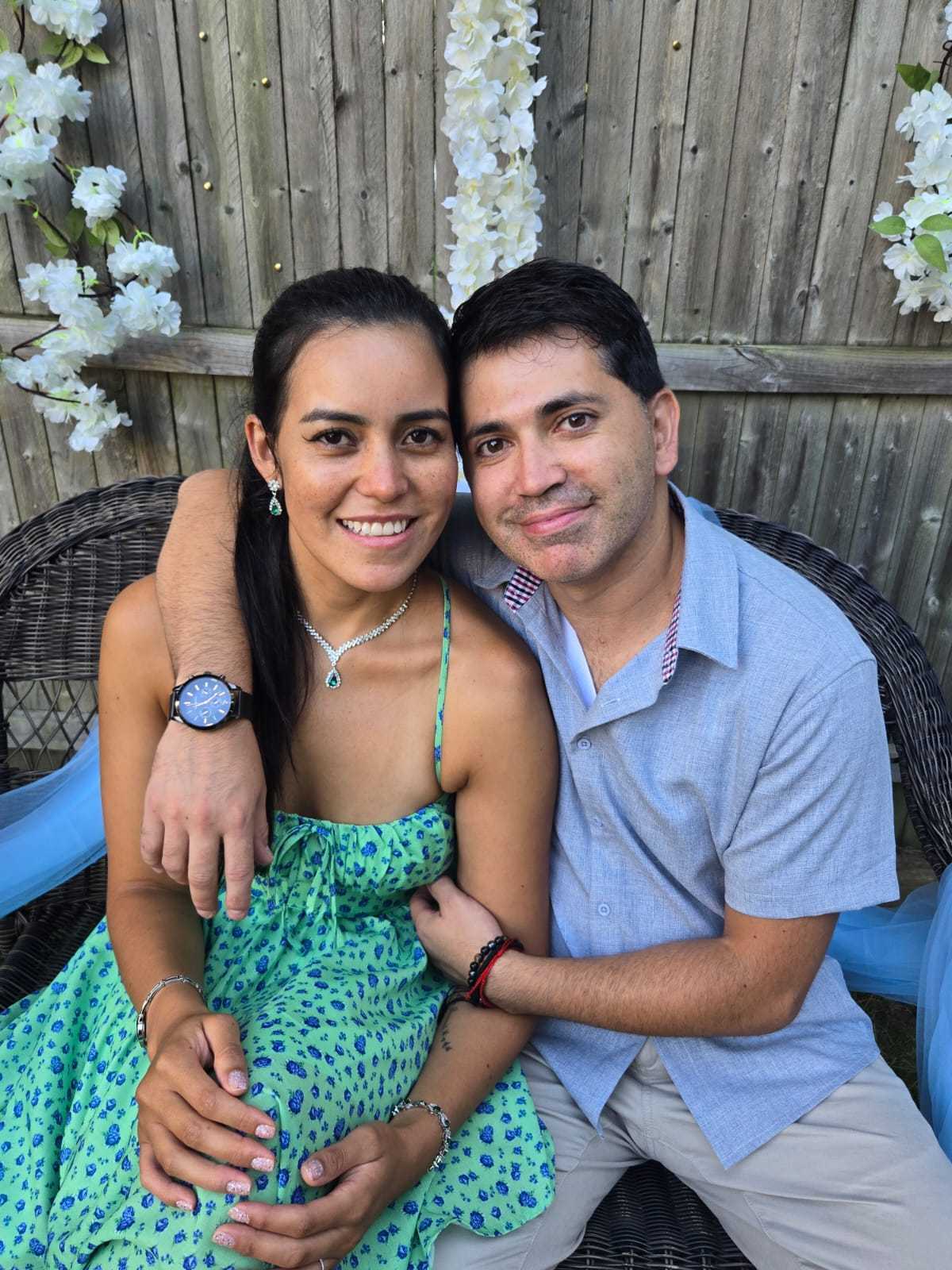 Angélica and Esteban seated together outdoors